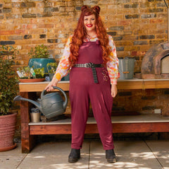 Woman wearing burgundy dungarees