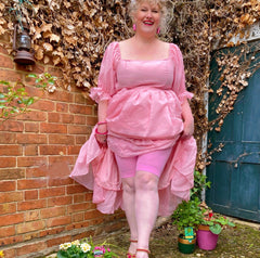 Woman wearing dragon fruit chub rub shorts