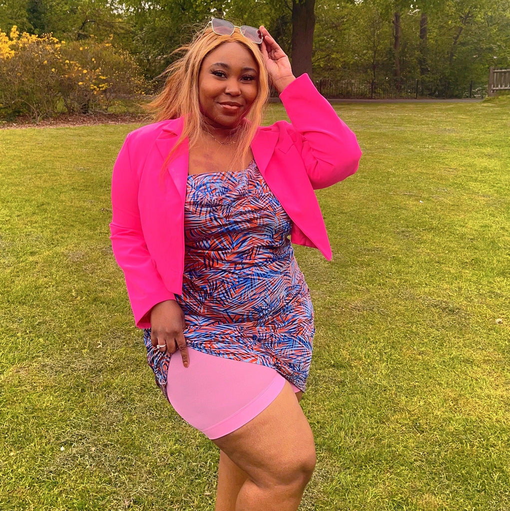 Woman wearing dragon fruit chub rub shorts