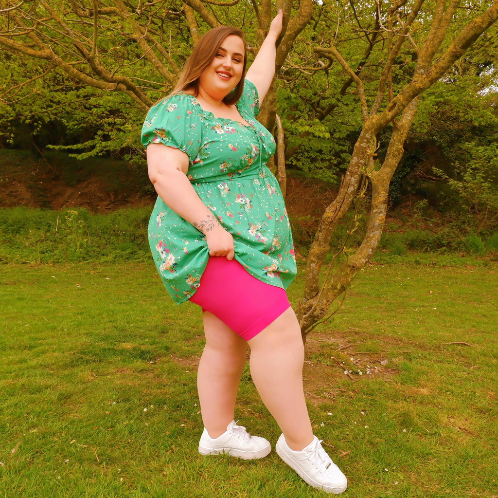 Woman wearing pomegranate chub rub shorts