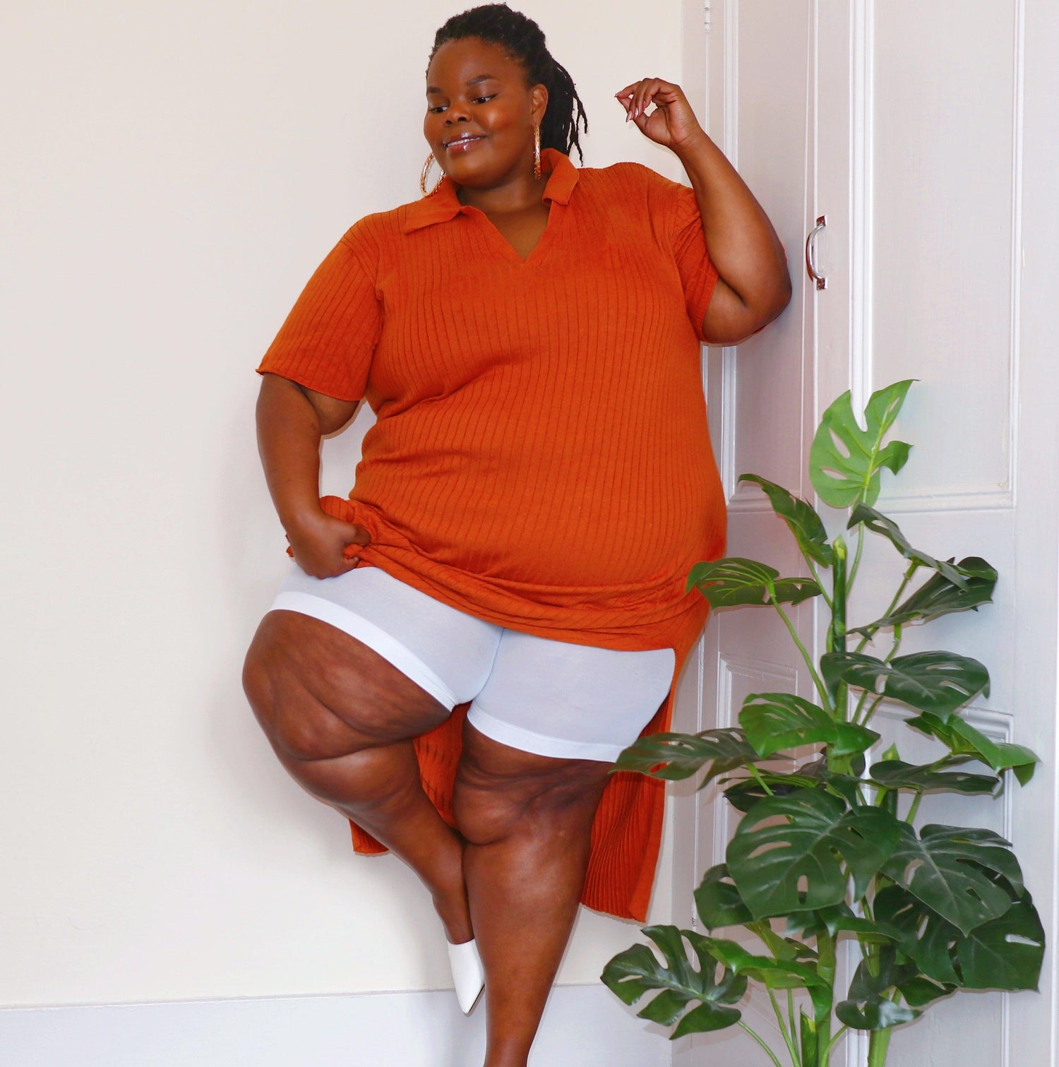 Woman wearing white chub rub shorts